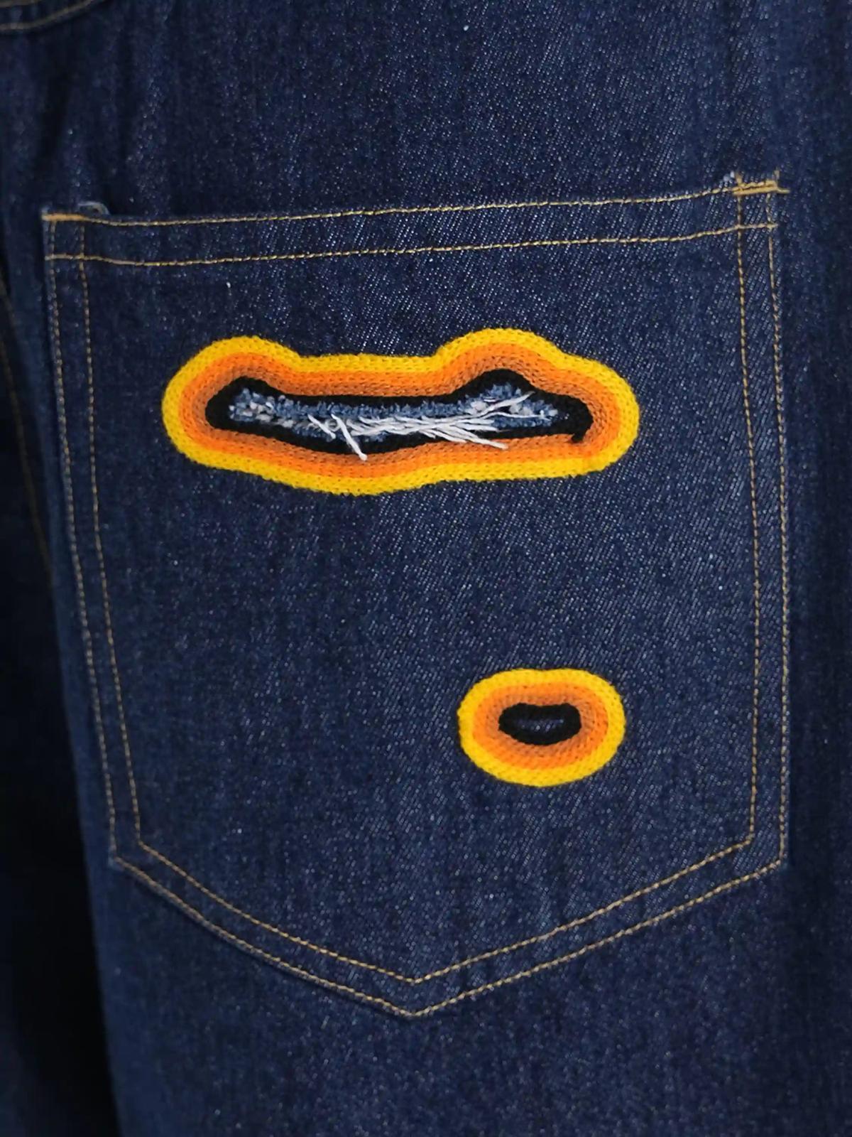 Flame-Scarred Towel Embroidered Jeans